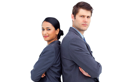 Two business people standing back to back, arms crossed